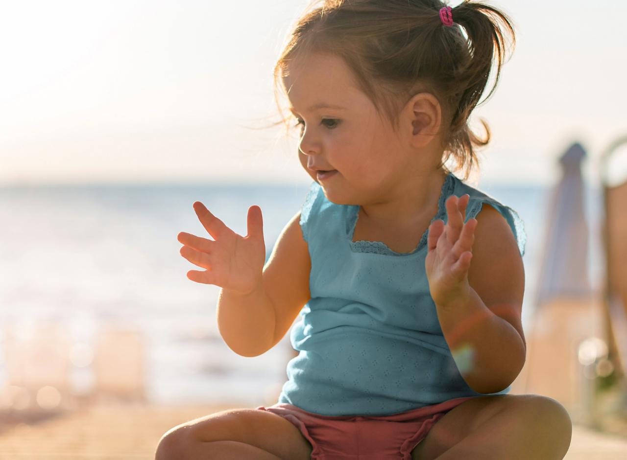 toddler-girl-clapping-beach-sunset.jpg